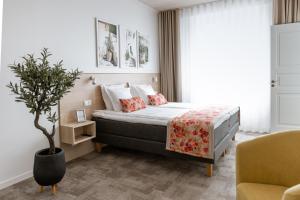 Postel nebo postele na pokoji v ubytování Old Hapsal Hotel