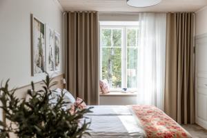 Postel nebo postele na pokoji v ubytování Old Hapsal Hotel