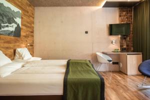 Postel nebo postele na pokoji v ubytování Hotel Arlmont 4 Stern Superior
