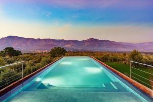 a swimming pool with a view of the mountains at Etna Retreat in Castiglione di Sicilia