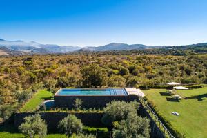 an aerial view of a house with a swimming pool at Etna Retreat in Castiglione di Sicilia