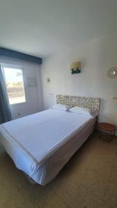 Postel nebo postele na pokoji v ubytování Hostal Roberto