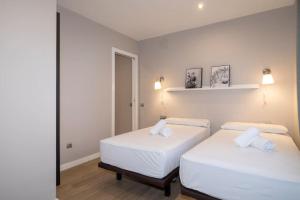 Posteľ alebo postele v izbe v ubytovaní BeBarceloner Sant Andreu Apartments - 3 bedrooms with terrace