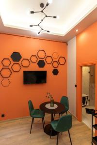 Televízia a/alebo spoločenská miestnosť v ubytovaní E12 Boutique Apartments