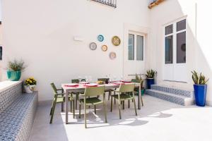 Area soggiorno di 2 Soru Ortigia Holiday Home - Attico con terrazza