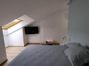 Łóżko lub łóżka w pokoju w obiekcie Pensión Residencial Platas