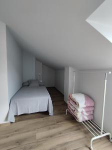 Łóżko lub łóżka w pokoju w obiekcie Pensión Residencial Platas