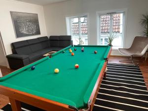 a living room with a pool table at Stavanger Bnb billiard Sauna in Stavanger