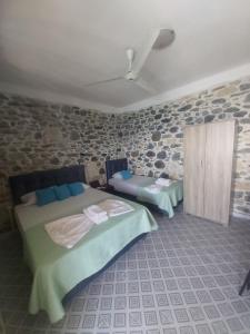 Postel nebo postele na pokoji v ubytování Mariaeva Rooms