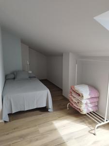 Łóżko lub łóżka w pokoju w obiekcie Pensión Residencial Platas