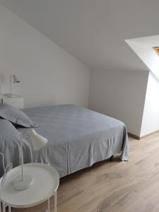 Łóżko lub łóżka w pokoju w obiekcie Pensión Residencial Platas