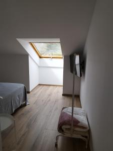 Łóżko lub łóżka w pokoju w obiekcie Pensión Residencial Platas