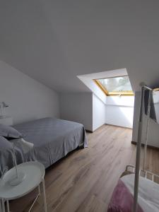 Łóżko lub łóżka w pokoju w obiekcie Pensión Residencial Platas
