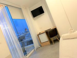 Ein Bett oder Betten in einem Zimmer der Unterkunft Hostal Fornet Altea