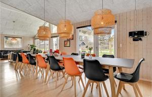 a large dining room with a long table and chairs at Gorgeous Home In Glesborg With Sauna in Glesborg