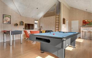 a living room with a pool table and ping pong tables at Gorgeous Home In Glesborg With Sauna in Glesborg