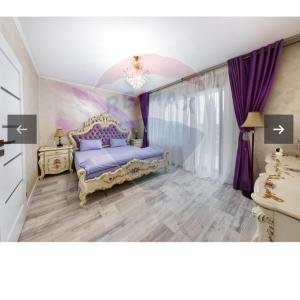 a bedroom with a bed and purple curtains at RAX Panoramic House in Feleacu