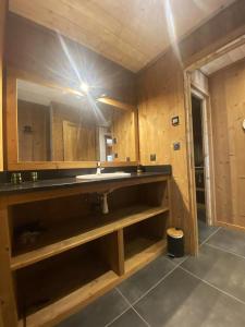 a bathroom with a sink and a mirror at Chalet de 6 chambres avec sauna terrasse amenagee et wifi a Font Romeu Odeillo Via a 1 km des pistes in Font Romeu Odeillo Via