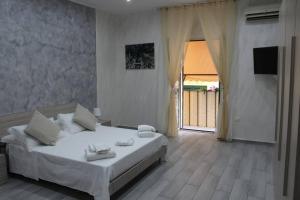 A bed or beds in a room at Casa Vacanza Grey