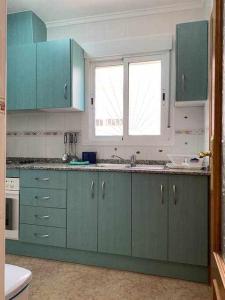 Kuchyňa alebo kuchynka v ubytovaní Acogedor duplex en la zona del Golf