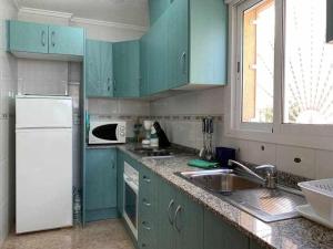 Kuchyňa alebo kuchynka v ubytovaní Acogedor duplex en la zona del Golf