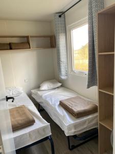 Postel nebo postele na pokoji v ubytování Camping de Contrexeville