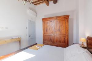Rúm í herbergi á Rifugio sulla via di Volpaia