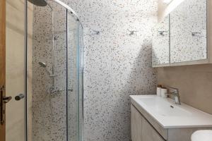 a bathroom with a shower and a sink at Residenza di Veta in Rethymno Town