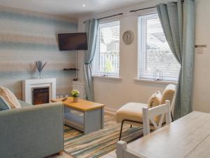 a living room with a couch and a table at Bell Tower B in Berwick-Upon-Tweed