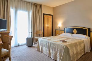 Postel nebo postele na pokoji v ubytování Hotel Macià Cóndor
