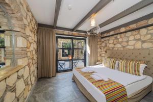 Postel nebo postele na pokoji v ubytování Alp Pasa Fiore Garden Suites - Special Class