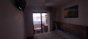 TV a/nebo společenská místnost v ubytování Apartamento Rincón Playa