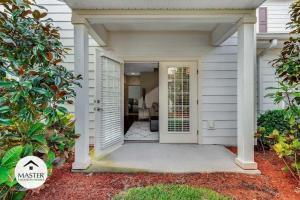 a front door of a house with a porch at 4 Bedrooms 3 Bathrooms Lucaya Village 15-101 in Orlando