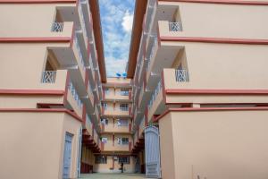 a view of an apartment building with balconies at Trice Homes One Bedroom Condo at Lavender Apartment in Nanyuki