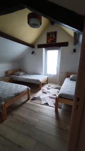 En eller flere senge i et værelse på Maison T4 a 6 minutes à pieds de Sarlat