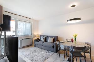 a living room with a couch and a table at Maison del Sasso Lago Maggiore in Leggiuno