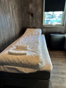 Postel nebo postele na pokoji v ubytování Norsk Havbrukssenter - Rorbuer