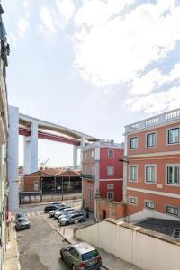 a parking lot with cars parked in front of buildings at Amaro I - Boutique 2 bed apartment in Alcantara in Lisbon