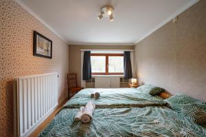 Postel nebo postele na pokoji v ubytování Gîte Europ'Aventure - Saint-Hubert