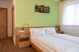Postel nebo postele na pokoji v ubytování Grünwald