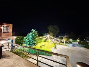 a view of a park at night at Keyman House Khao Yai in Pak Chong