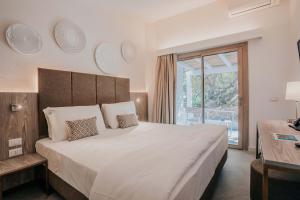 Postel nebo postele na pokoji v ubytování AMASEA Resort