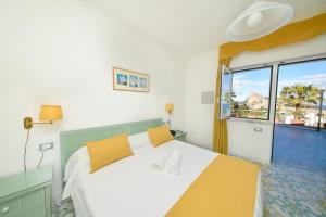 Postel nebo postele na pokoji v ubytování Hotel Parco Cartaromana