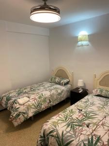 Łóżko lub łóżka w pokoju w obiekcie Apartamento Fuengirola beach