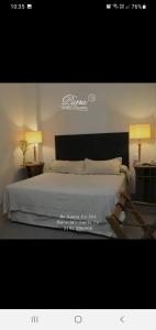 Кровать или кровати в номере Parra Hotel & Suites