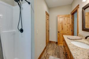 a bathroom with a sink and a shower and a mirror at Smoky Mountain Cabin Rental Game Room, Fire Pit! in Andrews +27 photos