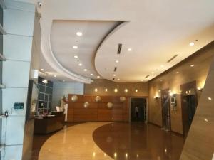 a lobby of a building with a large room at MANILA BAY EXECUTIVE SUITE pearl of orient in Manila +43 photos