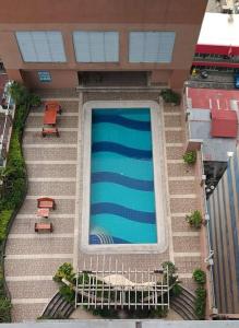 a swimming pool on the side of a building at MANILA BAY EXECUTIVE SUITE pearl of orient in Manila