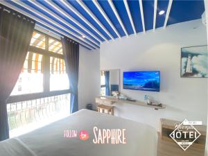 TV a/nebo společenská místnost v ubytování Riverside Mini Hotel Grand World Phu Quoc