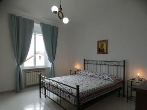 a bedroom with a bed and a window at CA' ARGENTINA Appartamento Vista MARE in La Spezia